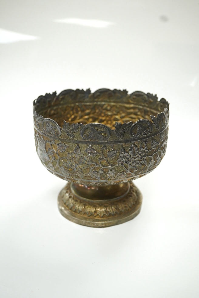 Two early to mid 20th century Indian white metal pedestal bowls, including one embossed with continuous hunting scene, diameters 14.2mm and 13.8mm, 18.1oz. Condition - poor